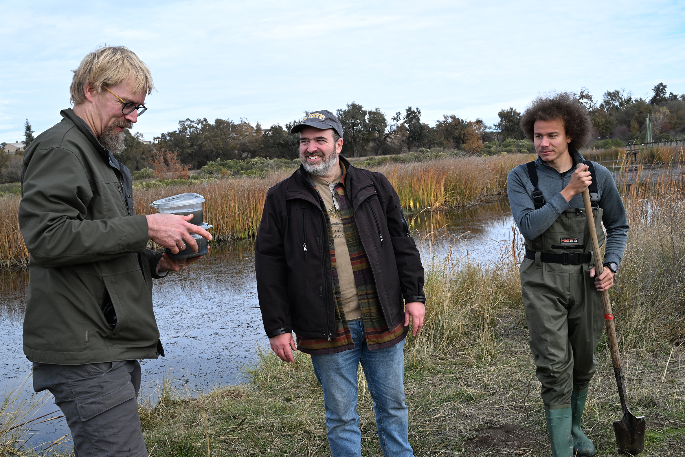 C Davis entomologist Geoffrey Attardo (center) and UC Davis doctoral candidate Christofer Brothers (right) chat with Mark Huising,  a UC Davis professor of Neurobiology, Physiology and Behavior at Cache Creek at a 2024 workshop. (Archived Photo by Kathy Keatley Garvey) 