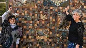 Gale Okumura (left) and Diane Ullman point to some of the art they created. (Photo by Kathy Keatley Garvey)