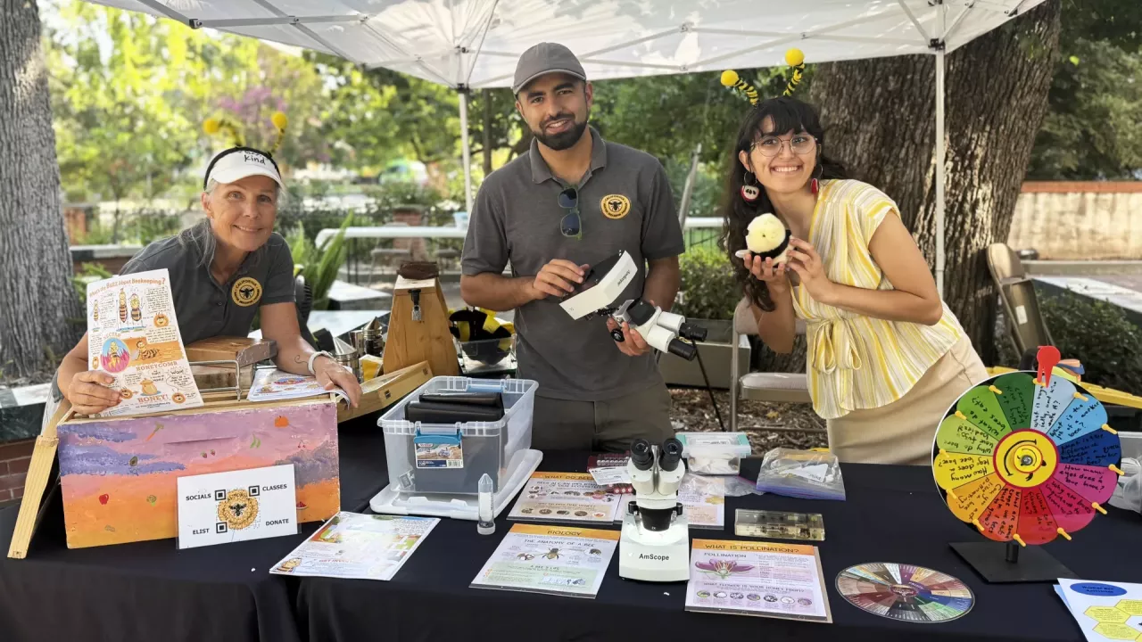 The CAMBP team ready to greet the crowd. From left are Wendy Mather and Kian Nikzad, co-program managers of CAMBP; and Samantha Murray, education and garden coordinator of the UC Davis Bee Haven. (Photo by Kathy Keatley Garvey)