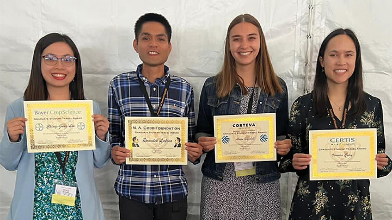 Four graduate students from the Siddique lab received travel awards. From left are Ching-Jung Lin, who received a Bayer CropScience award; Romnick Latina, N. A. Cobb Foundation Alison Blundell from Corteva; and Veronica Casey, Certis award.