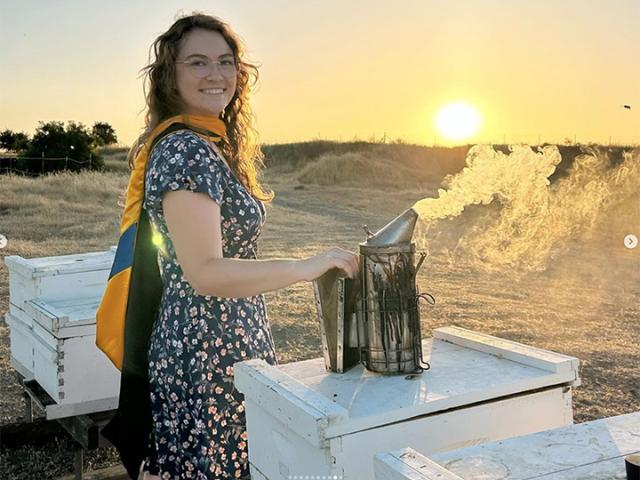 Elilza Litsky tending bees
