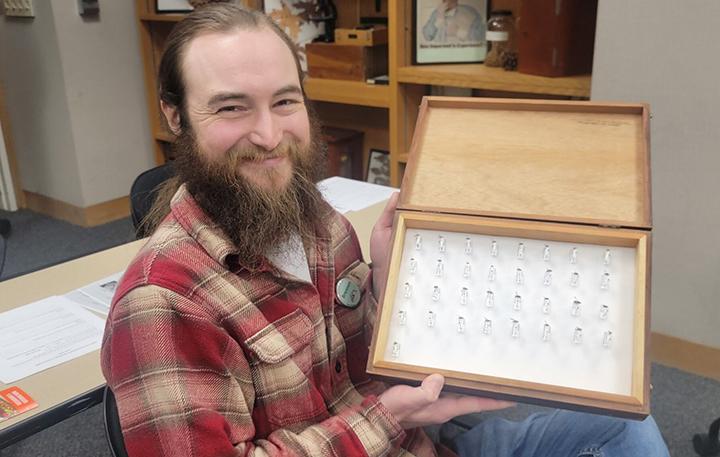 Brennen Dyer, collections manager of the Bohart Museum of Entomology, shows his work in the fruit fly-identification workshop. (Photo by Luc Leblanc)