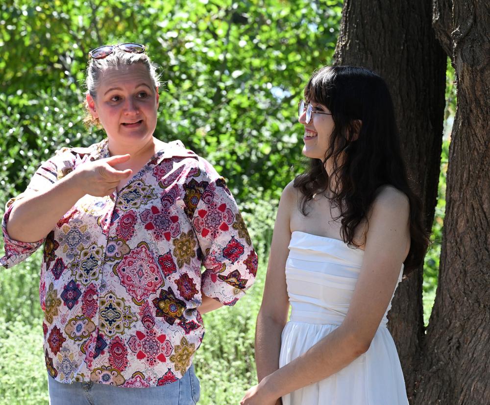 Elina Niño (left) director of the UC Davis Bee Haven, and Samantha Murray, education and garden coordinator of The Haven, talk to the group. (Photo by Kathy Keatley Garvey)