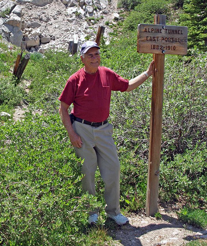 Bruce Eldridge at the end of a 2.8-mile hike on the Denver, South Park & Pacific Railroad grade up to the collapsed east portal of the Alpine Tunnel (11,523 ft elevation). Finished in 1882, it was the highest railroad tunnel in North America, 2012. (Photo by Ken Lorenzen).