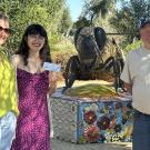Samantha Murray (center) education and garden coordinator of the UC Davis Bee Haven, receives research funds from Jim Guilliams, president of the El Dorado Beekeepers. At left is Haven director and bee scientist Elina Lastro Niño, professor of UC Cooperative Extension, Apiculture, and a key member of the UC Davis Department of Entomology and Nematology faculty.