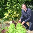 Professor Christian Nansen by a row of lettuce